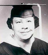 A black and white portrait of Leona Lusk Officer in her graduation regalia.