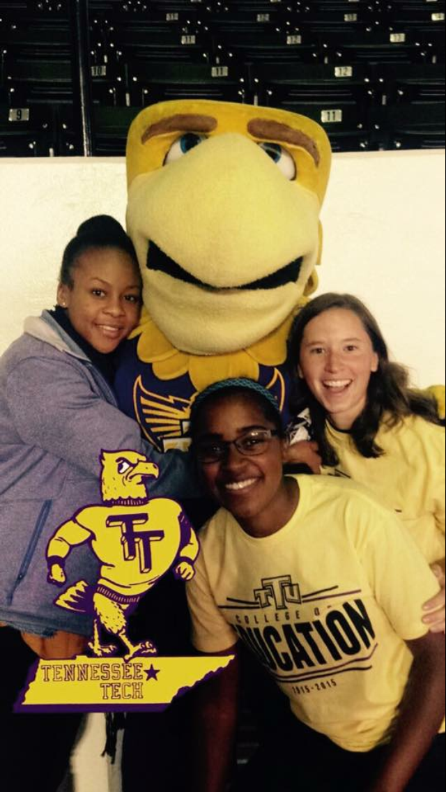 A photo of Elisa Tanksley Mask, Brittany Wiggins, and Melissa Edwards with Awesome Eagle.