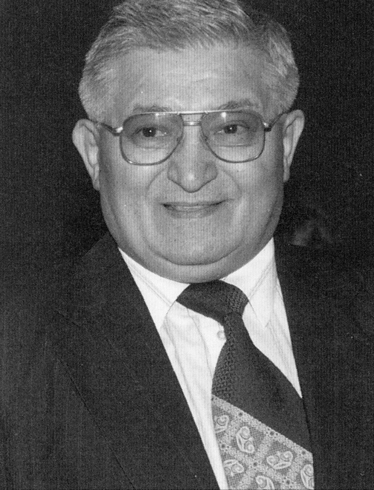 A black and white portrait of Dr. Cemil Bagci.