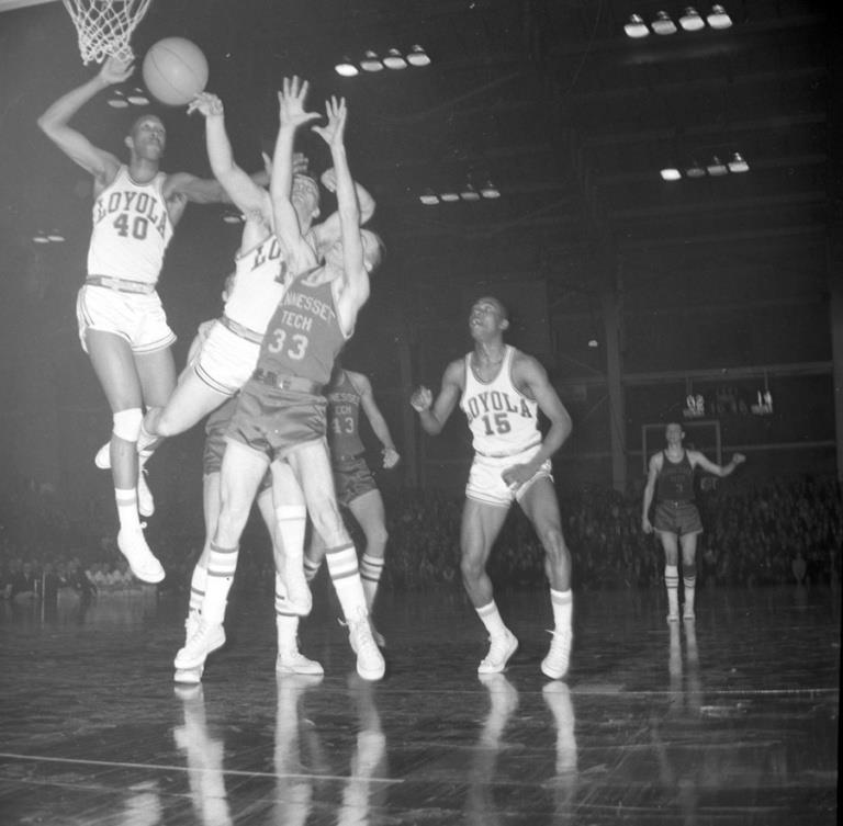 a black and white photo of a basketball game