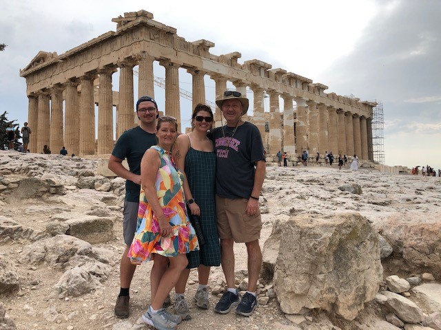 The Bible family smiling in front of the Acropolis.