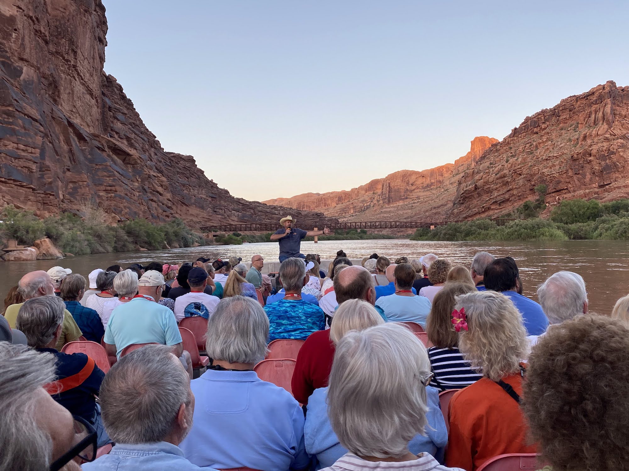 A man addresses a boat full of people at the Colorado River cruise