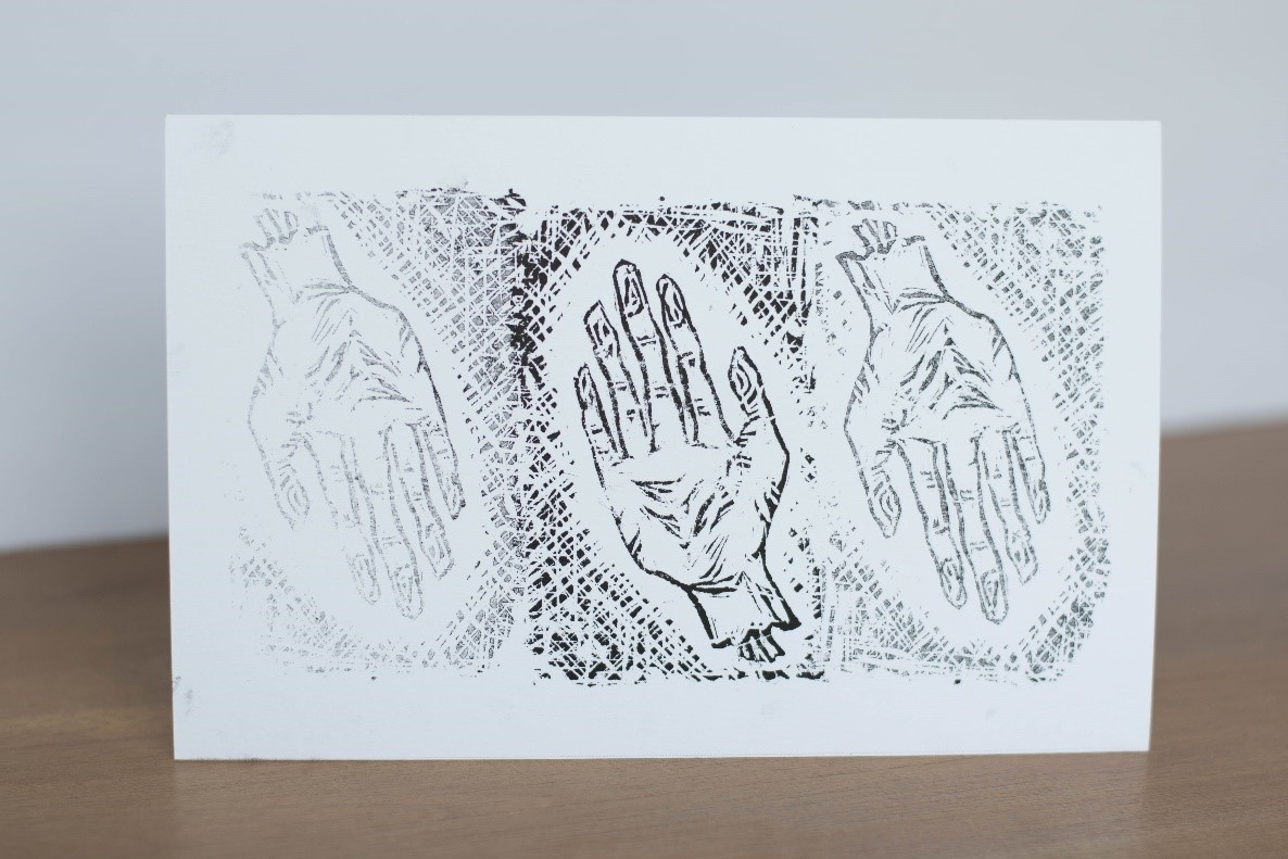 This is a picture of print artwork created by Anna that shows torn hands.